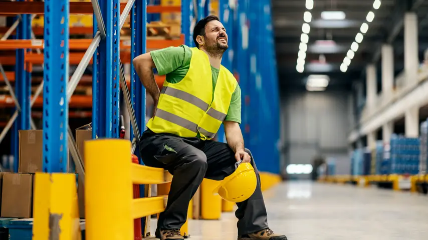 Male Warehouse Worker with Back Pain